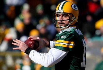 GREEN BAY, WI - DECEMBER 28: Aaron Rodgers #12 of the Green Bay Packers looks for a receiver against the Detroit Lions on December 28, 2008 at Lambeau Field in Green Bay, Wisconsin. The Packers defeated the Lions 31-21. (Photo by Jonathan Daniel/Getty Images)
