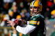 GREEN BAY, WI - DECEMBER 28: Aaron Rodgers #12 of the Green Bay Packers looks for a receiver against the Detroit Lions on December 28, 2008 at Lambeau Field in Green Bay, Wisconsin. The Packers defeated the Lions 31-21. (Photo by Jonathan Daniel/Getty Images)