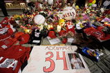 ANAHEIM, CA - APRIL 10:  Fans gather around a makeshift memorial to Los Angeles Angels pitcher Nick Adenhart outside Angel Stadium, after the game against the Boston Red Sox on April 10, 2009 in Anaheim, California. Adenhart and two others were killed in a car crash on Thursday,  April 9.  (Photo by Kevork Djansezian/Getty Images)