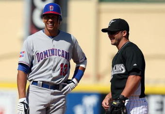 JUPITER, FL - MARCH 3:  Alex Rodriguez #13 of the Dominican Republic shares a laugh with second baseman Dan Uggla #6 of the Florida Marlins during an exhibition game at Roger Dean Stadium March 3, 2009 in Jupiter, Florida.  (Photo by Doug Benc/Getty Images)