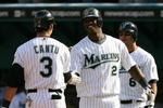 MIAMI - APRIL 06:  Jorge Cantu #3 of the Florida Marlins is congratulated by Hanley Ramirez #2 after his two-run home run in the thrid inning against the Washington Nationals on opening day at Dolphin Stadium on April 6, 2009 in Miami, Florida.  (Photo by Doug Benc/Getty Images)