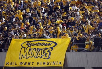 MORGANTOWN, WV - DECEMBER 1: Fans of the West Virginia Mountaineers watch the game during the game against the Pittsburgh Panthers at Milan Puskar Stadium on December 1, 2007 in Morgantown, West Virginia. (Photo by Kevin C. Cox/Getty Images)