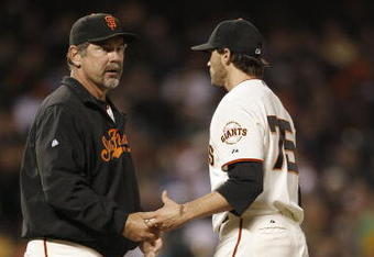 SAN FRANCISCO - JUNE 03:  Pitcher Barry Zito #75 hands the ball to manager Bruce Bochy #15 of the San Francisco Giants in the fifth inning against the New York Mets as Zito is taken out of the game June 3, 2008 at AT&T Park in San Francisco, California.  (Photo by Greg Trott/Getty Images)