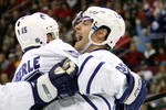 RALEIGH, NC - DECEMBER 18:  Teammate Thomas Kaberle #15 celebrates with Boyd Devereaux #22 of the Toronto Maple Leafs after Devereaux's goal against the Carolina Hurricanes during their game at the RBC Center on December 18, 2007 in Raleigh, North Carolina.  (Photo by Streeter Lecka/Getty Images)