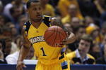 MILWAUKEE - FEBRUARY 25: Dominic James #1 of the Marquette Golden Eagles brings the ball upcourt against the Connecticut Huskies before breaking a bone in his foot during the first half on February 25, 2009 at the Bradley Center in Milwaukee, Wisconsin. Connecticut defeated Marquette 93-82. (Photo by Jonathan Daniel/Getty Images)