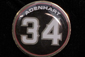 ANAHEIM, CA - APRIL 10:  A memorial pin with jersey number of pitcher Nick Adenhart of the Los Angeles Angels is seen on the jacket of his agent Scott Boras during the baseball game against the Boston Red Sox at Angel Stadium April 10, 2009 in Anaheim, California. Adenhart and two others were killed in car crash on April 9.  (Photo by Kevork Djansezian/Getty Images)