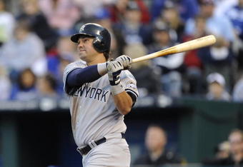 KANSAS CITY, MO - APRIL 11: Nick Swisher #33 of the New York Yankees watches a 2-run home run against the Kansas City Royals on April 11, 2009 at Kauffman Stadium in Kansas City, Missouri. (Photo by G. Newman Lowrance/Getty Images)