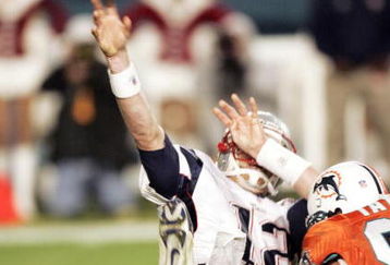 MIAMI - DECEMBER 20: Defensive end Jason Taylor #99 of the Miami Dolphins sacks Quarterback Tom Brady #12 of the New England Patriots at Pro Player Stadium on December 20, 2004 in Miami, Florida. (Photo by Eliot J. Schechter/Getty Images)