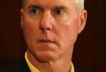 GREEN BAY, WI - MARCH 06: General manager Ted Thompson of the Green Bay Packers listens as quarterback Brett Favre announces his retirement at a press conference on March 6, 2008 at Lambeau Field in Green Bay, Wisconsin. (Photo by Jonathan Daniel/Getty Images)