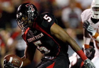 LUBBOCK, TX - NOVEMBER 01:  Michael Crabtree #5 of the Texas Tech Red Raiders carries the ball after making a reception during the first half of the game against the Texas Longhorns on November 1, 2008 at Jones Stadium in Lubbock, Texas.  (Photo by Jamie Squire/Getty Images)