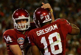 MIAMI - JANUARY 08:  Sam Bradford #14 of the Oklahoma Sooners celebrates with teammates Jermaine Gresham #18 after scoring a touchdown againist the Florida Gators during the FedEx BCS National Championship Game at Dolphin Stadium on January 8, 2009 in Miami, Florida.  (Photo by Donald Miralle/Getty Images)