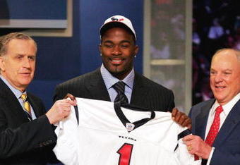 NEW YORK - APRIL 29:  NFL Commissioner Paul Tagliabue, Mario Williams, A defensive end from North Carolina State, and Houston Texans owner Bob McNair after the Texans selected Williams as the first pick of the 2006 NFL Draft by the Houston Texans at Radio City Music Hall on April 29, 2006 in New York City.  (Photo by Ezra Shaw/Getty Images)