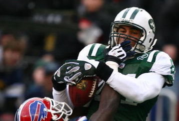 EAST RUTHERFORD, NJ - DECEMBER 14:  Dustin Keller #81 of the New York Jets has a pass broken up by Bryan Scott #43 of the Buffalo Bills during their game on December 14, 2008 at Giants Stadium in East Rutherford, New Jersey.  (Photo by Al Bello/Getty Images)