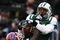 EAST RUTHERFORD, NJ - DECEMBER 14:  Dustin Keller #81 of the New York Jets has a pass broken up by Bryan Scott #43 of the Buffalo Bills during their game on December 14, 2008 at Giants Stadium in East Rutherford, New Jersey.  (Photo by Al Bello/Getty Images)