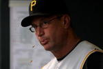 DENVER - JULY 19:  Manager John Russell #7 of the Pittsburgh Pirates spits sunflower seeds as he direct the action from the dugout against the Colorado Rockies at Coors Field on July 19, 2008 in Denver, Colorado. The Rockies defeated the Pirates 7-1.  (Photo by Doug Pensinger/Getty Images)