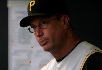 DENVER - JULY 19:  Manager John Russell #7 of the Pittsburgh Pirates spits sunflower seeds as he direct the action from the dugout against the Colorado Rockies at Coors Field on July 19, 2008 in Denver, Colorado. The Rockies defeated the Pirates 7-1.  (Photo by Doug Pensinger/Getty Images)