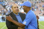 PASADENA, CA - SEPTEMBER 8:  UCLA athletic director Dan Guerrero shakes hands with head coach Karl Dorrell after the  Bruins defeated the BYU Cougars 27-17 at the Rose Bowl on September 8, 2007 in Pasadena, California. (Photo by Kevin Terrell/Getty Images)