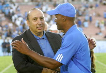 PASADENA, CA - SEPTEMBER 8:  UCLA athletic director Dan Guerrero shakes hands with head coach Karl Dorrell after the  Bruins defeated the BYU Cougars 27-17 at the Rose Bowl on September 8, 2007 in Pasadena, California. (Photo by Kevin Terrell/Getty Images)