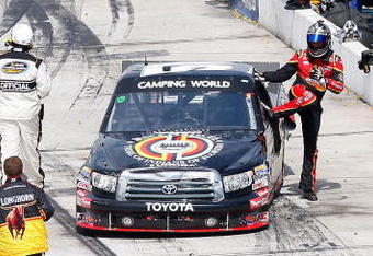 MARTINSVILLE, VA - MARCH 30: Kyle Bush driver of the #51 Miccosukee Toyota climbs from his truck after the NASCAR Camping World Truck Series Kroger 250 at the Martinsville Speedway on March 30, 2009 in Martinsville, Virginia.  (Photo by John Harrelson/Getty Images)