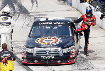 MARTINSVILLE, VA - MARCH 30: Kyle Bush driver of the #51 Miccosukee Toyota climbs from his truck after the NASCAR Camping World Truck Series Kroger 250 at the Martinsville Speedway on March 30, 2009 in Martinsville, Virginia.  (Photo by John Harrelson/Getty Images)