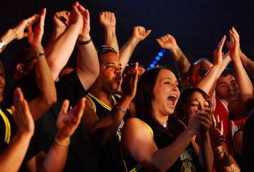 HOLLYWOOD, FL - SEPTEMBER 20:  Fans cheer during the the International Fight League World Championship Finals on September 19, 2007 at the Hard Rock Hotel and Casino in  Hollywood, Florida  The International Fight League is the worlds first team based professional mixed martial arts league.  In a match, two teams compete against each other with the winning team being the one whose members win three of five one on one matches in five weight divisions.  Competition goes in a round robin format amongst 12 teams with the teams with the two best records ultimately competing for the IFL Championship.  (Photo by Al Bello/Getty Images)