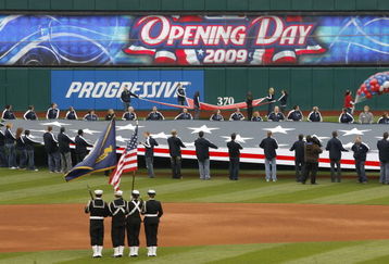 CLEVELAND - APRIL 10:  Fans stand for the national anthem prior to the start of the Cleveland Indians and Toronto Blue Jays game April 10, 2009 at Progressive Field in Cleveland, Ohio.  (Photo by Matt Sullivan/Getty Images)