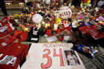 ANAHEIM, CA - APRIL 10:  Fans gather around a makeshift memorial to Los Angeles Angels pitcher Nick Adenhart outside Angel Stadium, after the game against the Boston Red Sox on April 10, 2009 in Anaheim, California. Adenhart and two others were killed in a car crash on Thursday,  April 9.  (Photo by Kevork Djansezian/Getty Images)