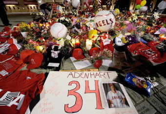 ANAHEIM, CA - APRIL 10:  Fans gather around a makeshift memorial to Los Angeles Angels pitcher Nick Adenhart outside Angel Stadium, after the game against the Boston Red Sox on April 10, 2009 in Anaheim, California. Adenhart and two others were killed in a car crash on Thursday,  April 9.  (Photo by Kevork Djansezian/Getty Images)