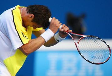 MELBOURNE, AUSTRALIA - JANUARY 19:  Marat Safin of Russia reacts after a point in his first round match against Ivan Navarro of Spain during day one of the 2009 Australian Open at Melbourne Park on January 19, 2009 in Melbourne, Australia.  (Photo by Clive Brunskill/Getty Images)