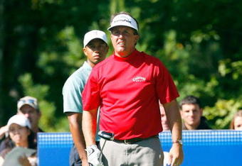 NORTON, MA - SEPTEMBER 1:  Phil Mickelson and Tiger Woods watch Mickelson's drive from the 18th tee box during the second round of Deutsche Bank Championship, the second event of the new PGA TOUR Playoffs for the FedExCup at TPC Boston on September 1, 2007 in Norton, Massachusetts.  (Photo by J. Rogash/Getty Images)