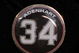 ANAHEIM, CA - APRIL 10:  A memorial pin with jersey number of pitcher Nick Adenhart of the Los Angeles Angels is seen on the jacket of his agent Scott Boras during the baseball game against the Boston Red Sox at Angel Stadium April 10, 2009 in Anaheim, California. Adenhart and two others were killed in car crash on April 9.  (Photo by Kevork Djansezian/Getty Images)