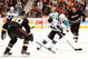 ANAHEIM, CA - OCTOBER 17:  Marcel Goc #11 of the San Jose Sharks skates in with the puck as he is watched by Kent Huskins #40 and Teemu Selanne #8 of the Anaheim Ducks during the second period at the Honda Center on October 17, 2008 in Anaheim, California.  (Photo by Harry How/Getty Images)