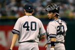 TAMPA, FL - JULY 14:  Starting pitcher Chien-Ming Wang #40 of the New York Yankees talks with catcher Jorge Posada #20 after Wang gave up three runs in the first inning against the Tampa Bay Devil Rays at Tropicana Field on July 14, 2007 in St. Petersburg, Florida.  (Photo by Doug Benc/Getty Images)