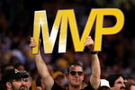 LOS ANGELES, CA - MAY 07:  A fan holds up an MVP sign as Kobe Bryant #24 of the Los Angeles Lakers is awarded the MVP trophy during the Lakers' win over the Utah Jazz in Game Two of the Western Conference Semifinals during the 2008 NBA Playoffs on May 7, 2008 at Staples Center in Los Angeles, California.  NOTE TO USER: User expressly acknowledges and agrees that, by downloading and/or using this Photograph, user is consenting to the terms and conditions of the Getty Images License Agreement.  (Photo by Stephen Dunn/Getty Images)