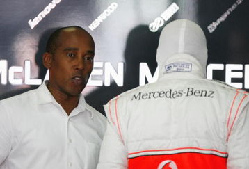 KUALA LUMPUR, MALAYSIA - APRIL 05:  Lewis Hamilton of Great Britain and McLaren Mercedes is seen with his father Anthony Hamilton in his team garage before the start of the Malaysian Formula One Grand Prix at the Sepang Circuit on April 5, 2009 in Kuala Lumpur, Malaysia.  (Photo by Paul Gilham/Getty Images)
