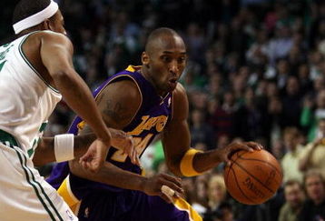 BOSTON - FEBRUARY 05:  Kobe Bryant #24 of Los Angeles Lakers drives around Paul Pierce #34 of the Boston Celtics on February 5, 2009 at TD Banknorth Garden in Boston, Massachusetts. The Lakers defeated the Celtics 110-109 in overtime. NOTE TO USER: User expressly acknowledges and agrees that, by downloading and or using this Photograph, user is consenting to the terms and conditions of the Getty Images License Agreement.  (Photo by Elsa/Getty Images)