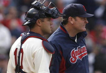 CLEVELAND - MARCH 31:  Catcher Kelly Shoppach (10) of the Cleveland Indians talks with manager Eric Wedge #22 (R) during the the sixth inning of their Opening Day game against the Chicago White Sox on March 31, 2008 at Progressive Field in Cleveland, Ohio.  (Photo by Matt Sullivan/Getty Images)