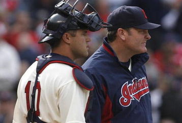 CLEVELAND - MARCH 31:  Catcher Kelly Shoppach (10) of the Cleveland Indians talks with manager Eric Wedge #22 (R) during the the sixth inning of their Opening Day game against the Chicago White Sox on March 31, 2008 at Progressive Field in Cleveland, Ohio.  (Photo by Matt Sullivan/Getty Images)