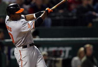ARLINGTON, TX - APRIL 13:  Adam Jones #10 of the Baltimore Orioles hits a RBI double against the Texas Rangers in the fourth inning on April 13, 2009 at Rangers Ballpark in Arlington, Texas.  (Photo by Ronald Martinez/Getty Images)