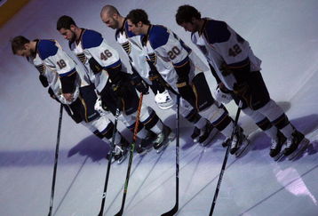 GLENDALE, AZ - APRIL 07:  The St. Louis Blues stand attended during the National Anthem before the NHL game against the Phoenix Coyotes at Jobing.com Arena on April 7, 2009 in Glendale, Arizona.  The Blues defeated the Coyotes 5-1.  (Photo by Christian Petersen/Getty Images)