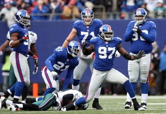 EAST RUTHERFORD, NJ - DECEMBER 07: Mathias Kiwanuka #97 of the New York Giants celebrates a tackle agianst the Philadelphia Eagles at Giants Stadium on December 7, 2008 in East Rutherford, New Jersey.  (Photo by Nick Laham/Getty Images)