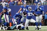 EAST RUTHERFORD, NJ - DECEMBER 07: Mathias Kiwanuka #97 of the New York Giants celebrates a tackle agianst the Philadelphia Eagles at Giants Stadium on December 7, 2008 in East Rutherford, New Jersey.  (Photo by Nick Laham/Getty Images)