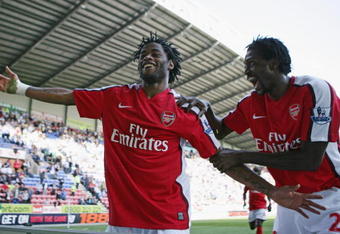 WIGAN, ENGLAND - APRIL 11:  Alexandre Song of Arsenal celebrates scoring the fourth goal with Emmanuel Adebayor during the Barclays Premier League match between Wigan Athletic and Arsenal at The JJB Stadium on April 11, 2009 in Wigan, England.  (Photo by Laurence Griffiths/Getty Images)