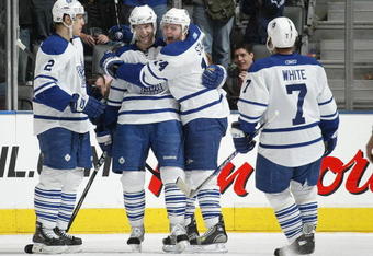 TORONTO - APRIL 11:  Boyd Devereaux #22 of the Toronto Maple Leafs celebrates his 3rd goal of the game with his teammatesin a game against the Ottawa Senators on April 11, 2009 at the Air Canada Centre in Toronto, Ontario. The Leafs defeated the Senators on the strength of a 3 goal performance by Boyd Devereaux #22. (Photo by Claus Andersen/Getty Images)