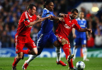 LONDON, ENGLAND - APRIL 14:  Jamie Carragher (R) and Javier Mascherano of Liverpool challenge Didier Drogba of Chelsea during the UEFA Champions League Quarter Final Second Leg match between Chelsea and Liverpool at Stamford Bridge on April 14, 2009 in London, England.  (Photo by Ryan Pierse/Getty Images)