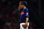 BOSTON - OCTOBER 20:  Starting pitcher Fausto Carmona #55 of the Cleveland Indians wipes his face while standing on the mound against the Boston Red Sox during Game Six of the American League Championship Series at Fenway Park on October 20, 2007 in Boston, Massachusetts.  (Photo by Elsa/Getty Images)