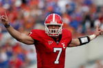 JACKSONVILLE, FL - NOVEMBER 01:  Quarterback Matthew Stafford #7 of the Georgia Bulldogs calls out a play at the line of scrimmage while taking on the Florida Gators at Jacksonville Municipal Stadium on November 1, 2008 in Jacksonville, Florida. Florida defeated Georgia 49-10.  (Photo by Doug Benc/Getty Images)