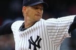 NEW YORK - APRIL 04:  A.J. Burnett #34 of the New York Yankees pitches against the Chicago Cubs during their game on April 4, 2009 at Yankee Stadium in the Bronx borough of New York City.  (Photo by Chris McGrath/Getty Images)