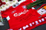 LIVERPOOL, ENGLAND - APRIL 11:  A Liverpool shirt is laid in tribute at the Liverpool memorial for those who died in the Hillsborough disaster prior to the Barclays Premier League match obetween Liverpool and Blackburn at Anfield on April 11, 2009 in Liverpool, England.   On April 15 it will be the 20th anniversary of the Hillsborough disaster, the bells of Liverpools two cathedrals will ring 96 times in memory of the 96 fans who lost their lives. At 3:06pm, exactly 20 years since the match was abandoned Liverpools public transport will stop for 2 minutes. There will also be a memorial service on the Kop where 96 candles will be lit and a representative from each family will be awarded the freedom of the city  (Photo by Clive Rose/Getty Images)