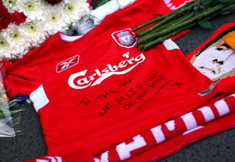 LIVERPOOL, ENGLAND - APRIL 11:  A Liverpool shirt is laid in tribute at the Liverpool memorial for those who died in the Hillsborough disaster prior to the Barclays Premier League match obetween Liverpool and Blackburn at Anfield on April 11, 2009 in Liverpool, England.   On April 15 it will be the 20th anniversary of the Hillsborough disaster, the bells of Liverpools two cathedrals will ring 96 times in memory of the 96 fans who lost their lives. At 3:06pm, exactly 20 years since the match was abandoned Liverpools public transport will stop for 2 minutes. There will also be a memorial service on the Kop where 96 candles will be lit and a representative from each family will be awarded the freedom of the city  (Photo by Clive Rose/Getty Images)